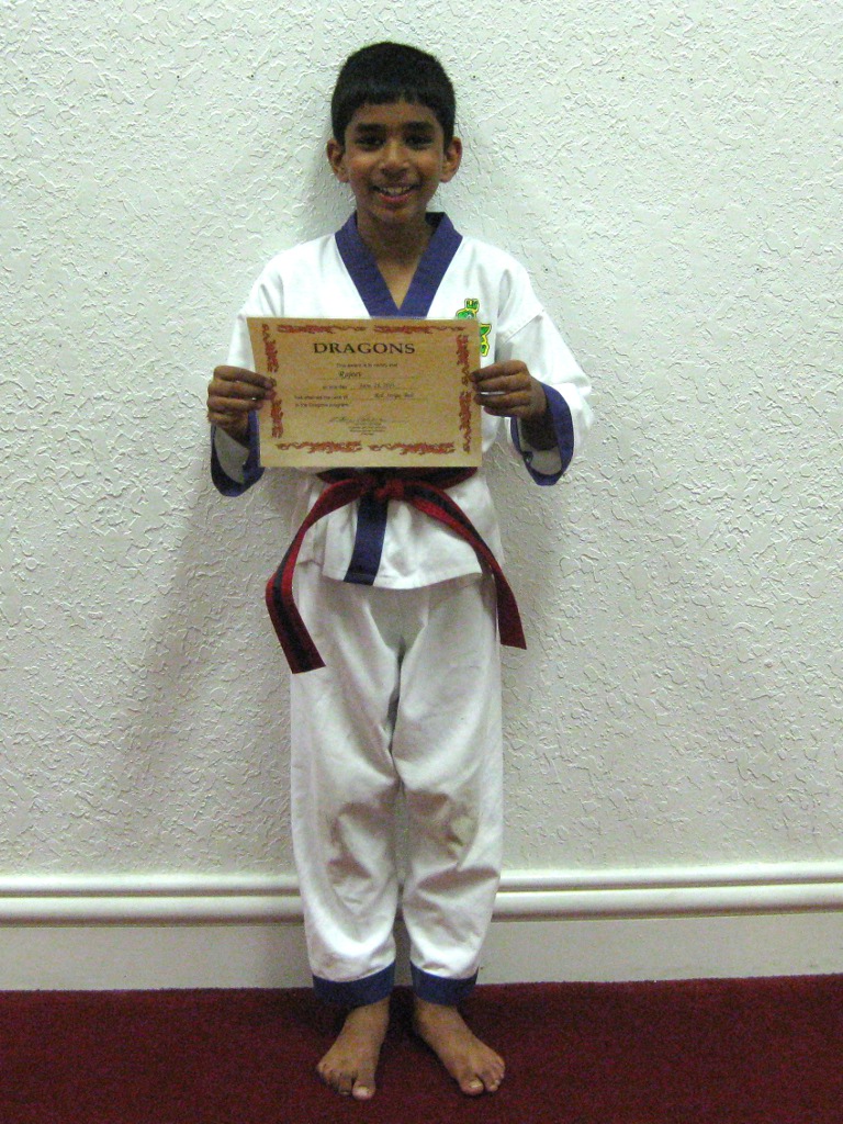 Rajeev with newly awarded certificate for red striped belt Rajeev with newly awarded certificate for red striped belt