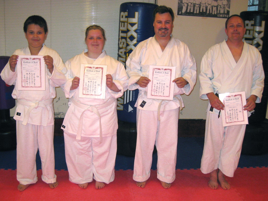 Anel, Kaley, Joseph and Joseph with newly awarded diplomas for 8, 8, 8 and 2 kyu Anel, Kaley, Joseph and Joseph with newly awarded diplomas for 8, 8, 8 and 2 kyu